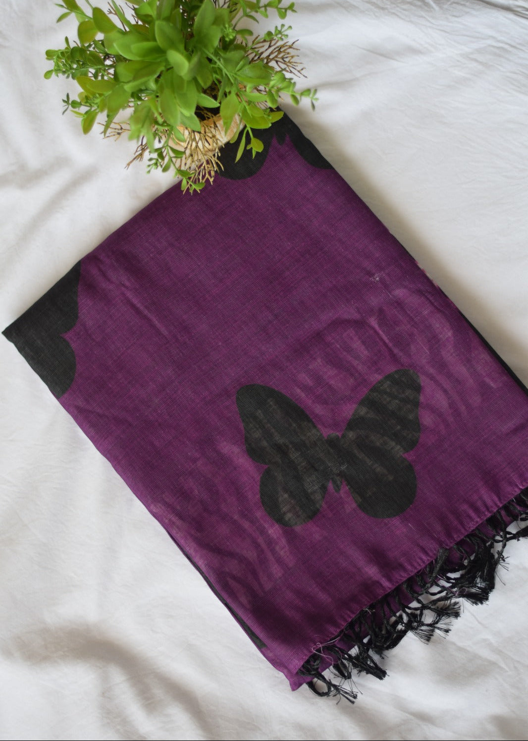 Purple Chanderi Linen Cotton with black butterfly designs on a white surface