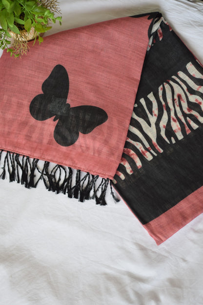 Pink tChanderi Linen Cotton saree  with a black butterfly design and zebra pattern border on a white surface.