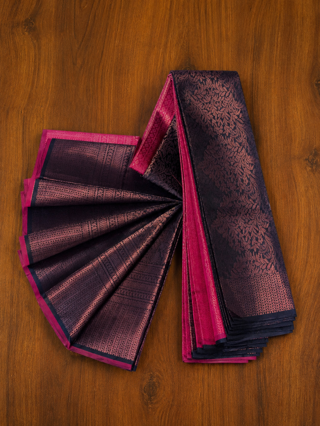 Navy blue and magenta pink kubera patt saree featuring copper zari floral motifs from Thambai online store.