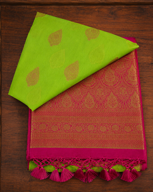 Lime green and magenta pink butter silk saree with traditional golden zari pallu and tassels from Thambai online store.