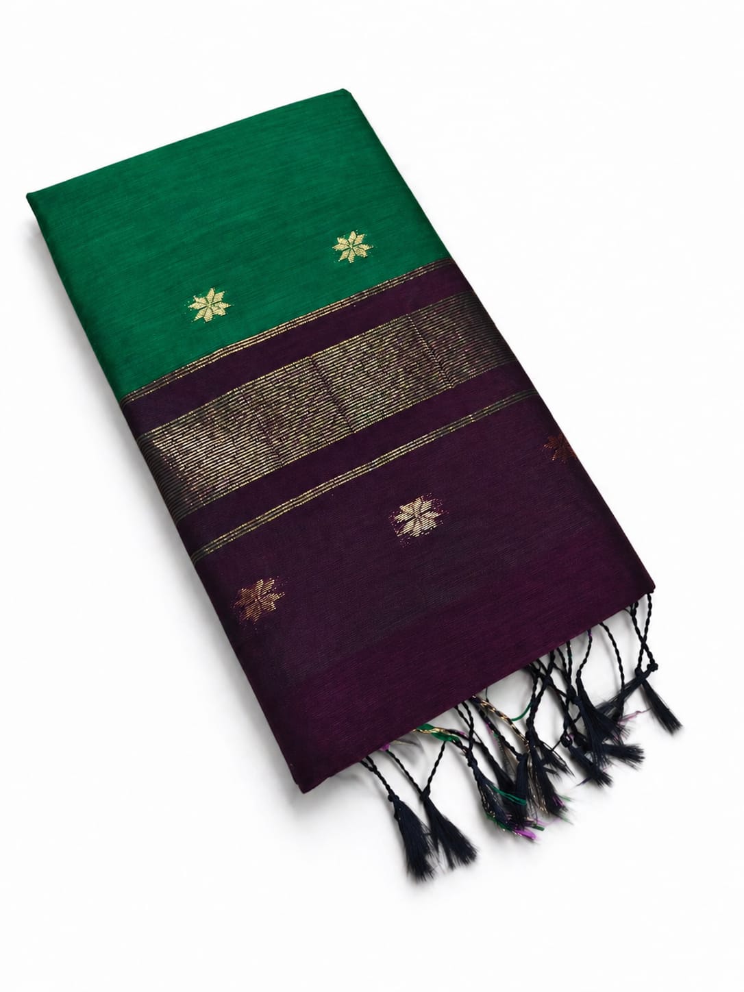 Green and purple saree with floral patterns and tassels on a white background