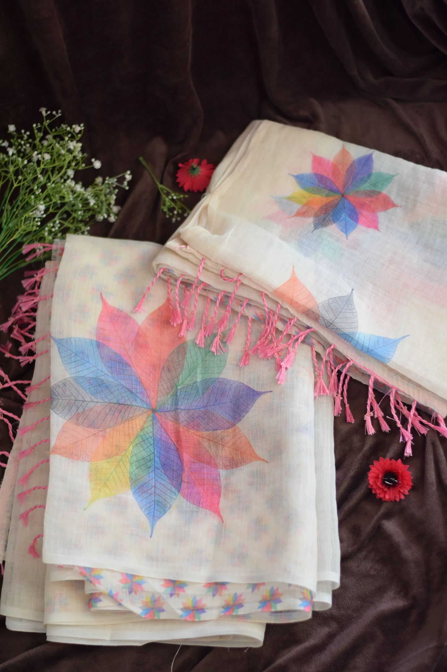Mayookha_Ice cream saree-Skeletal Leaf Mandala  from saree from thambai-with colorful design on a dark background