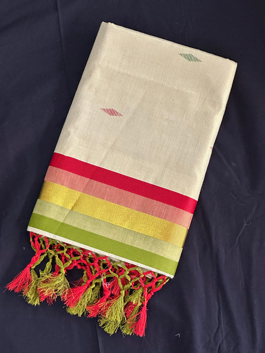 Paarijaatham_Multicolor Border Kerala traditional tissue set saree from saree from thambai with colorful stripes and tassels on a dark background