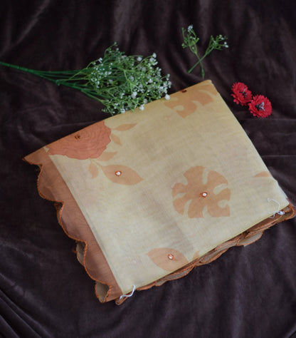 organza cotton saree  with floral pattern on a dark background