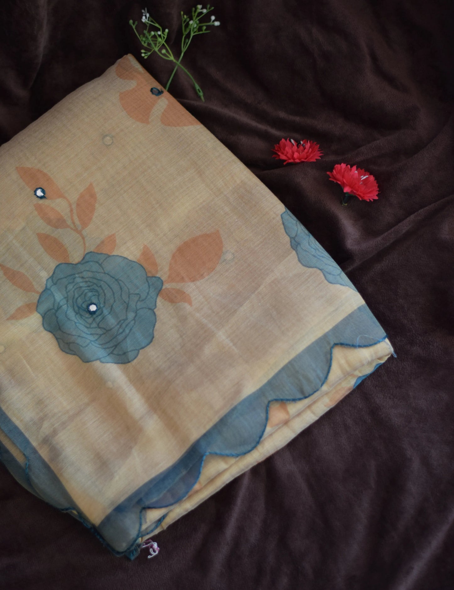 organza cotton saree with floral design on a dark background